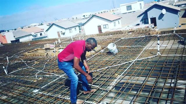 Steel reinforcement being placed for a concrete slab