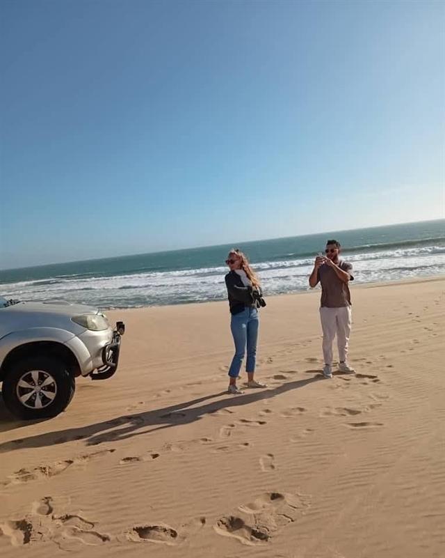 Guests on the beach during a coastal tour