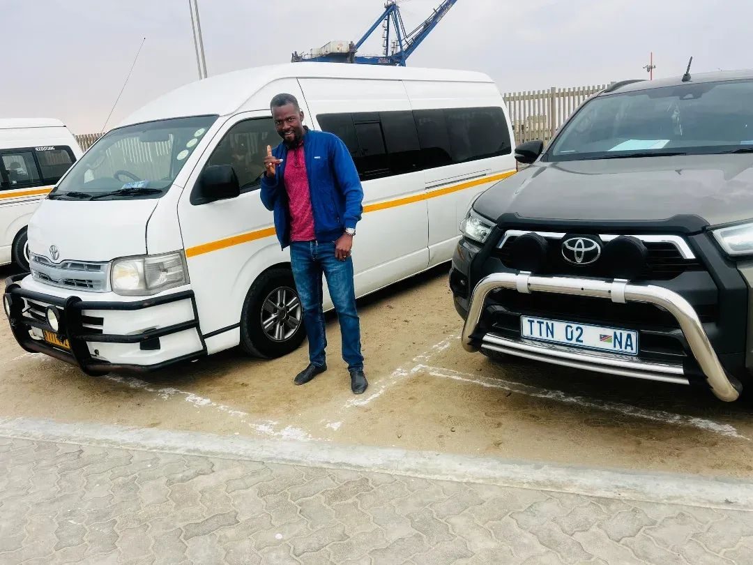 TTN shuttle van and branded Hilux at the port